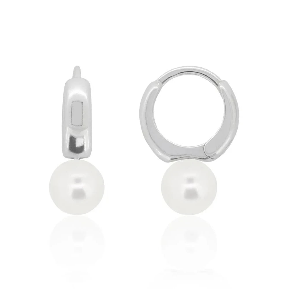 8mm pearl huggie hoop earrings in nickel-free sterling silver, perfect for sensitive ears, shown in classic white pearl.