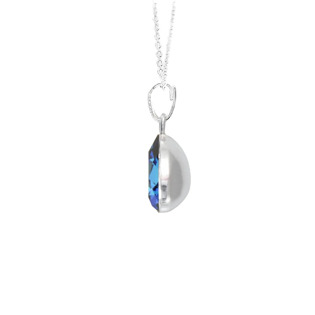 Side view of the personalised pear-shaped pendant necklace in sterling silver with Bermuda Blue Pear-Cut Crystal