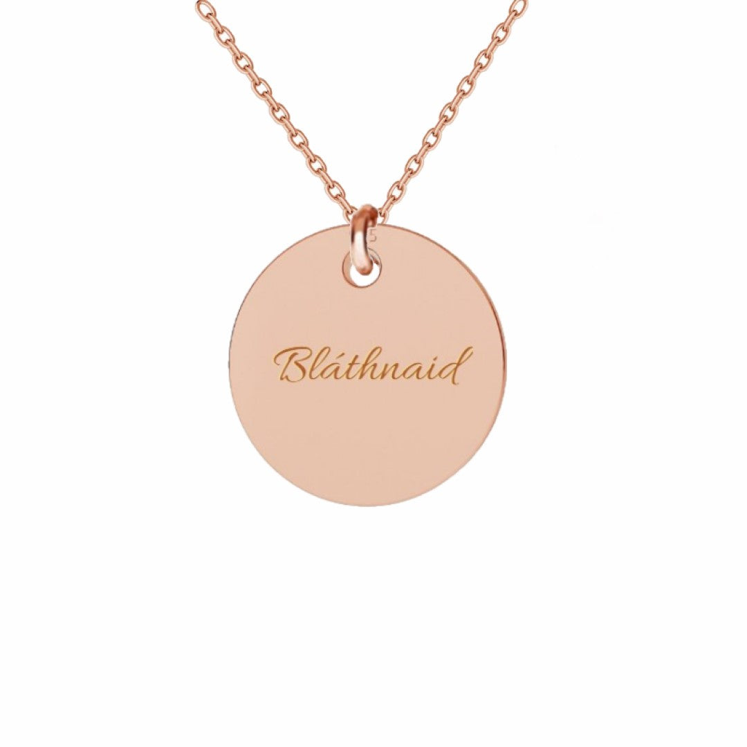 Rose gold circular pendant with one engraved name, a simple and elegant piece for personalised jewellery lovers.