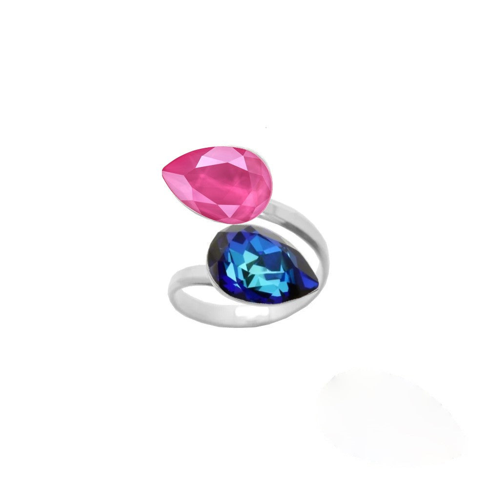 Women's dual crystal ring with a unique wrap-around design, made from 925 Sterling silver and showcasing Bermuda Blue and Peony Pink pear-cut crystals, created by Magpie Gems in Ireland.