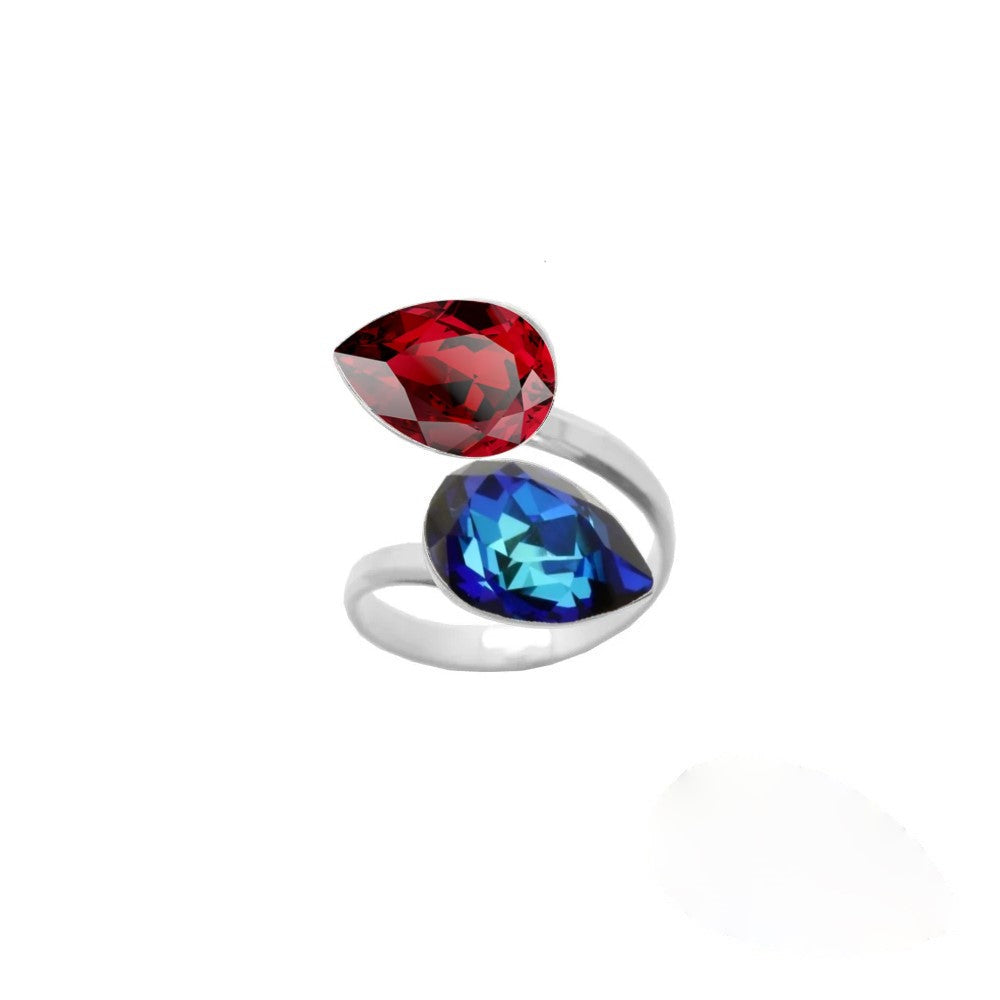 A stunning 925 Sterling silver wrap-around ring with two pear-cut crystals, featuring Bermuda Blue and Scarlet Red teardrop colours, handmade for women by Magpie Gems in Ireland.