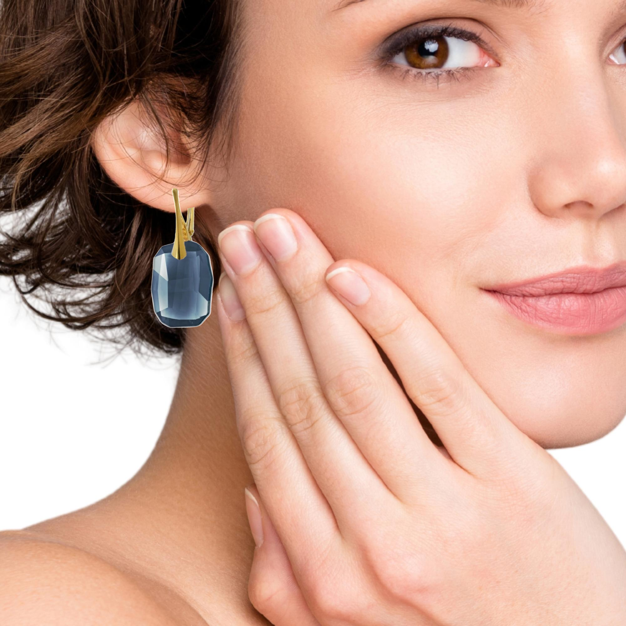 Gold Earrings with Large Denim Blue Graphic Crystal Drop and Gold Leverback worn by a model, showcasing their perfect size and design.