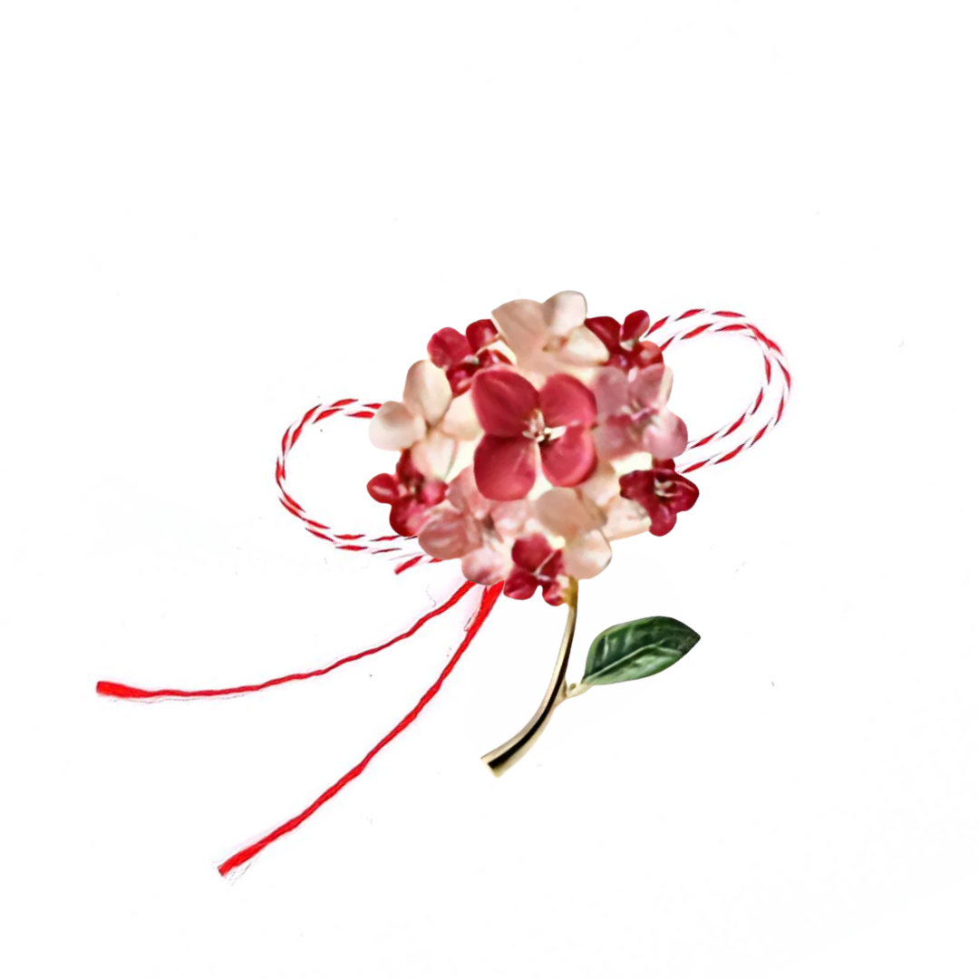 Red and Pink Hydrangea Martisor Brooch on a white background, showcasing vibrant enamelled hydrangea blooms with golden accents, symbolising spring and new beginnings, paired with the traditional red and white Martisor bow.