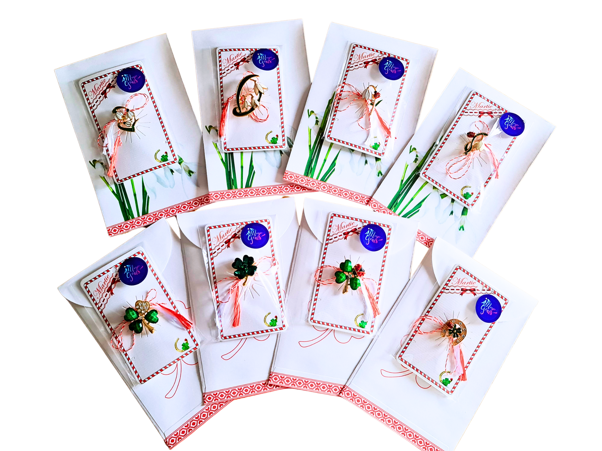 Set of 8 Martisor brooches featuring snowdrop flower designs, each paired with a paper gift envelope. The brooches are beautifully presented with red and white string and displayed on traditional Romanian support cards.