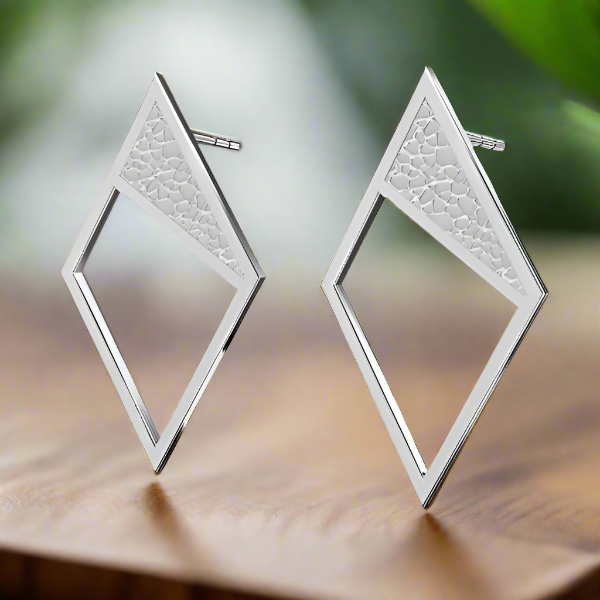 Close-up of Modern Silver Rhombus Stud Earrings with minimalistic design