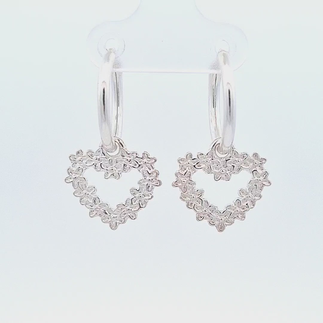 45-degree video of the Heart with Forget-Me-Not Flowers Charm Hoop Earrings in Sterling Silver