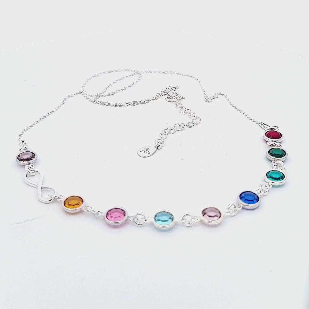 Showcase video of the 'Legacy of Love' Grandmother Birthstone Infinity Necklace by Magpie Gems, featuring an infinity symbol and a sequence of birthstones, presented on a white background.