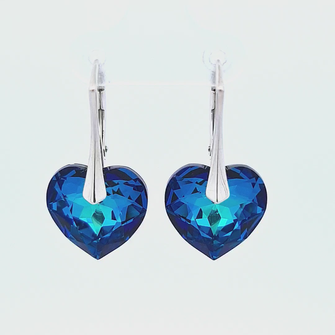 Woman Silver Heart Drop Earrings with Bermuda Blue Crystals, 45-degree view