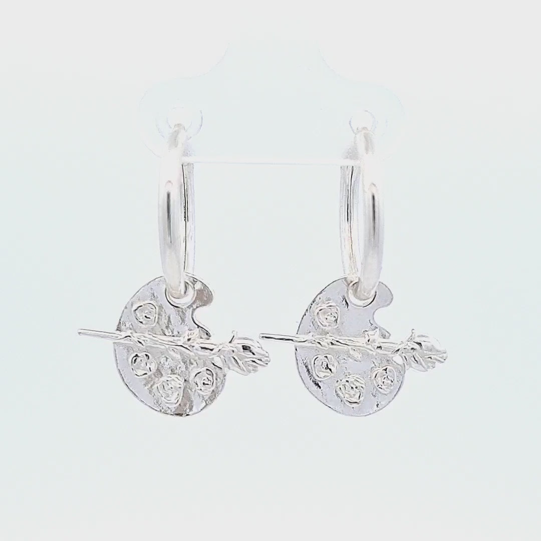 Video showcasing the Irish Hand-Finished Sterling Silver Rose on Paint Palette Charm Hoop Earrings by Magpie Gems Ireland