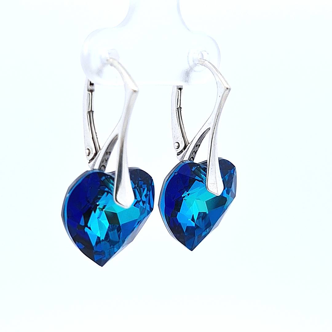 Woman Silver Heart Drop Earrings with Bermuda Blue Crystals, side view