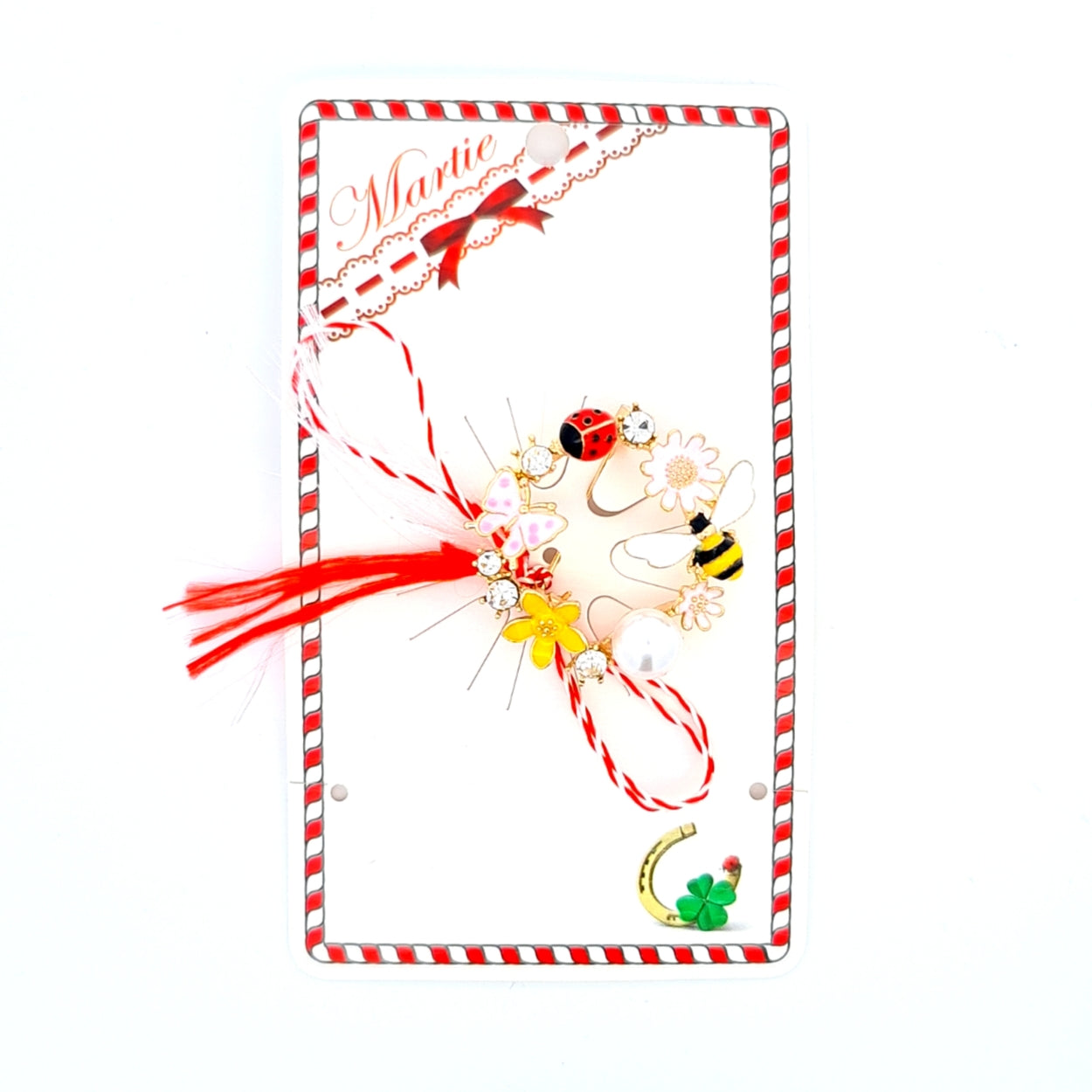 Spring Garden Martisor Brooch on a card, featuring a circular design adorned with enamelled flowers, a bee, a ladybird, a butterfly, sparkling crystals, and a central pearl, paired with the traditional red and white Martisor bow to symbolise spring and vitality.