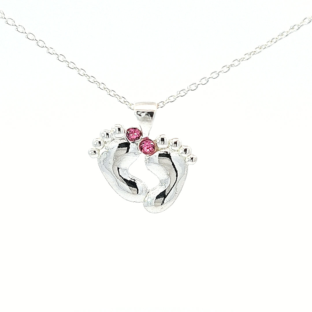 Sterling silver baby loss necklace with baby feet charm pendant and pink Austrian crystals for a girl