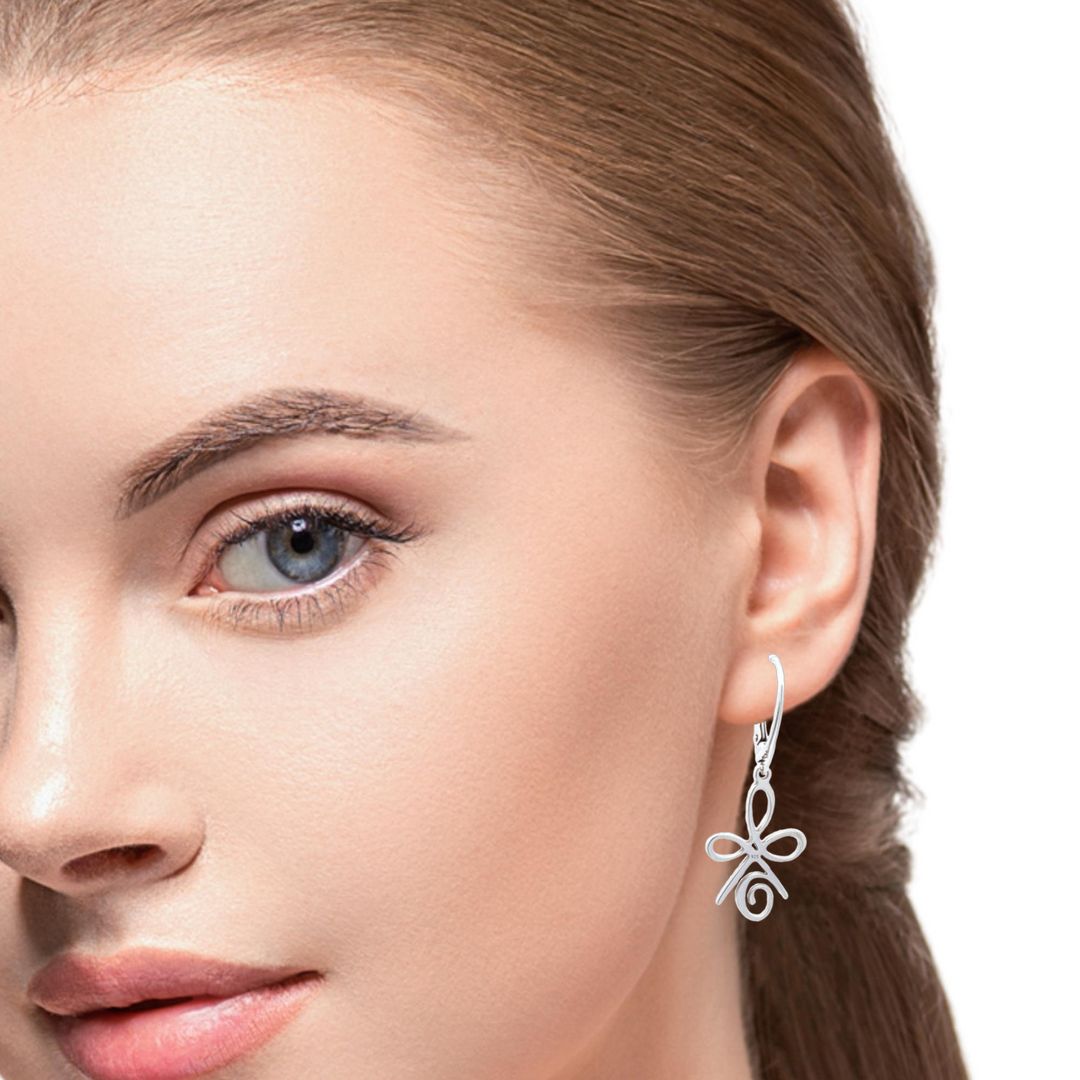 Woman wearing the Silver Celtic Dangle and Drop Earrings with 925 Sterling Silver Leverbacks.