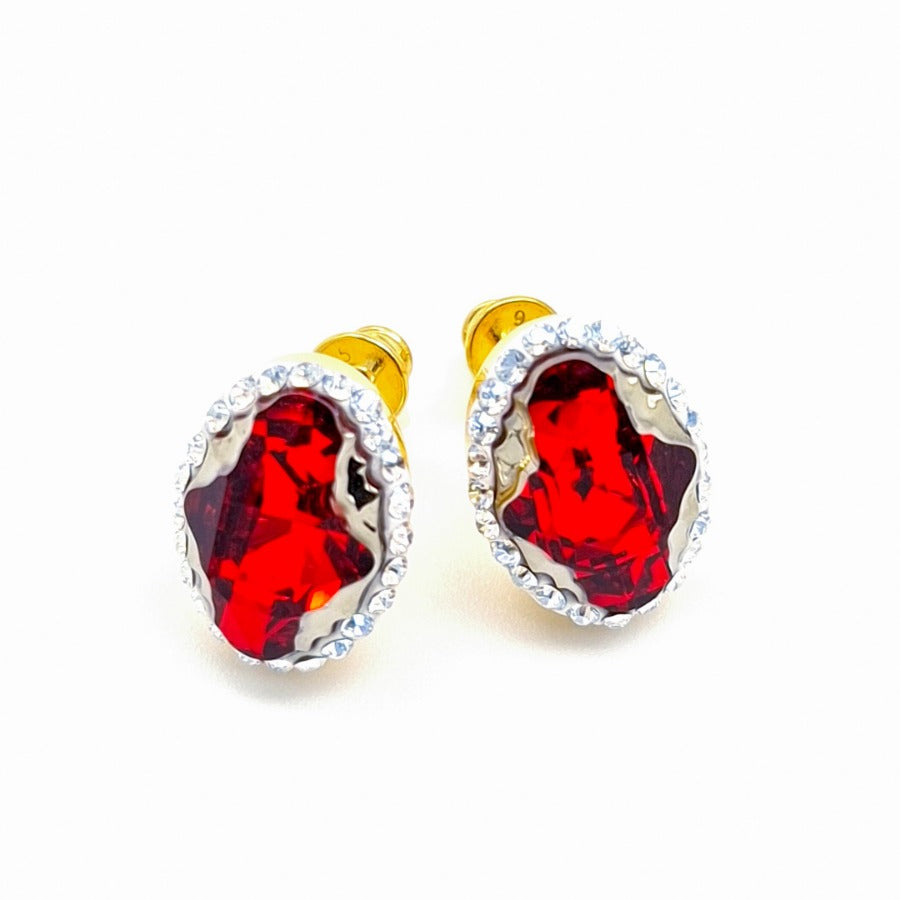 Close-up of Red Oval Tribe Crystal Gold Stud Earrings with Moonlight Crystal Halo for Women by Magpie Gems Ireland