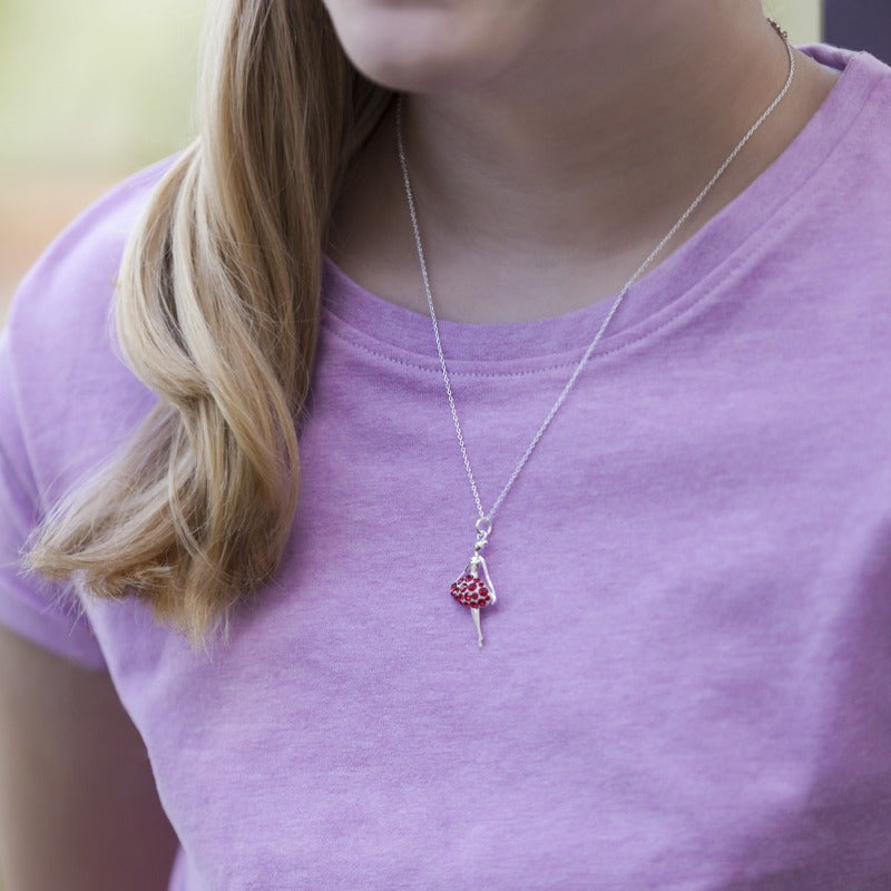 Close-up of Gilr Wearing the Ballerina Dancer Pendant with Red Crystals on Skirt