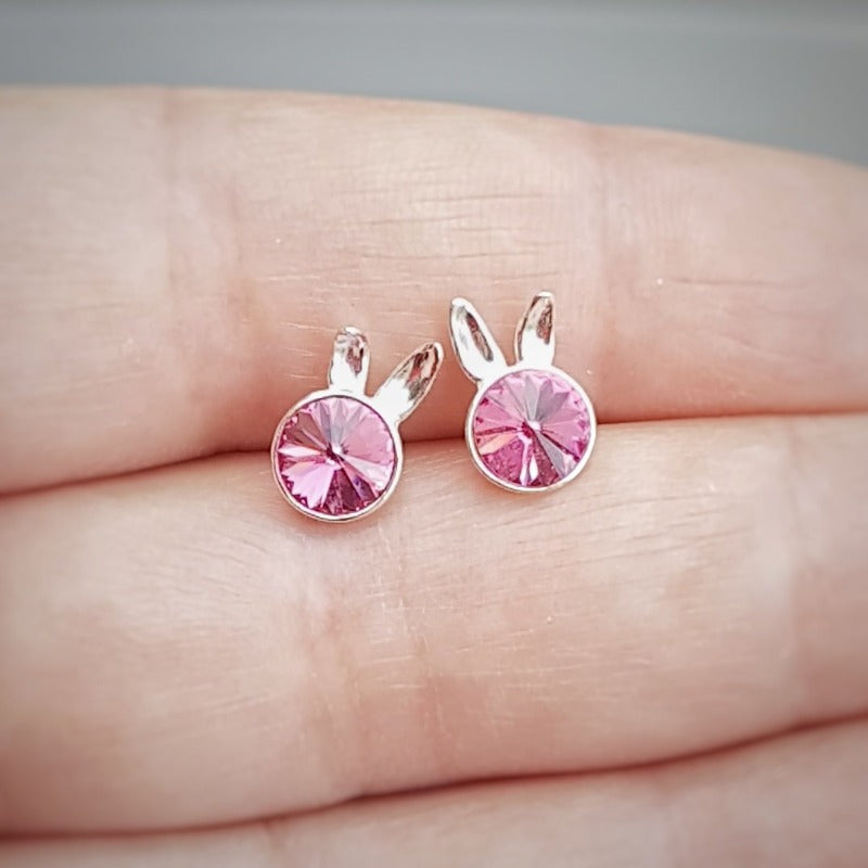 Close-up of Sterling Silver Bunny Stud Earrings showcasing the playful bunny ears design and rose pink crystal.