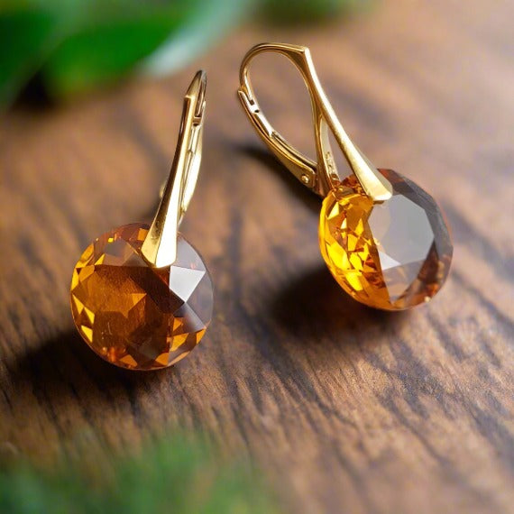 Close-up of November Elegance Topaz Earrings with 30mm drop and secure leverback in Sterling Silver (24k Gold Plated)..