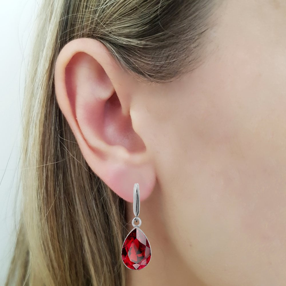 Woman Floating Pear-Cut Dangle Earrings in Sterling Silver with Red Austrian Crystals