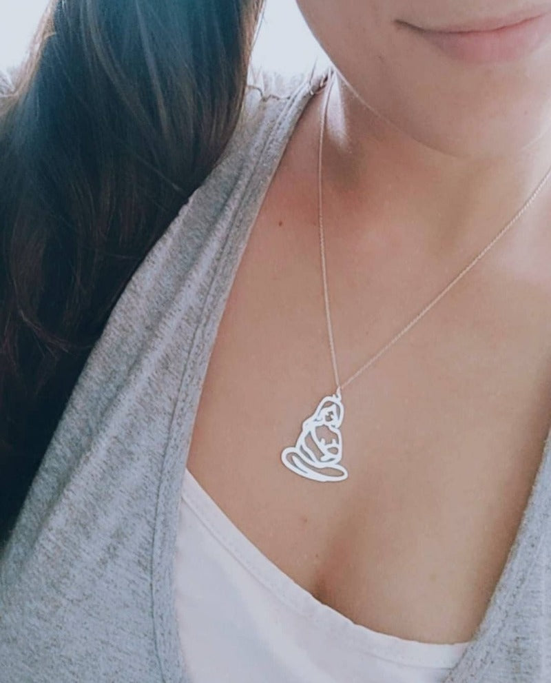 Woman Wearing the Silver Charming Motherhood Necklace with Mother Nursing 1 Baby Pendant